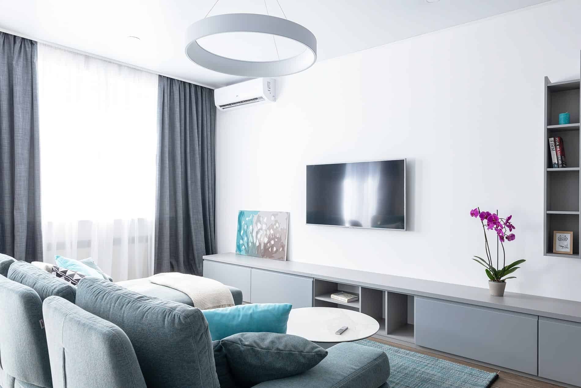 A living room with a sofa and television